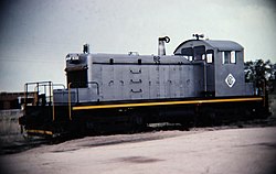 Silver CLK diesel locomotive on siding in Colorado