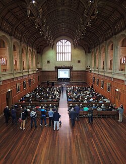 This is a photograph of the interior of Bonython Hall during a public forum on nuclear energy.