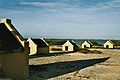 Image 10The forced African migrants brought to the Caribbean lived in inhumane conditions. Above are examples of slave huts in Dutch Bonaire. About 5 feet tall and 6 feet wide, between 2 and 3 slaves slept in these after working in nearby salt mines. (from History of the Caribbean)