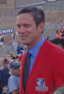 Drew Bledsoe in a red sports jacket.