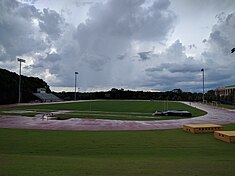 The soccer field and track with grandstand (left)