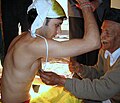 Image 13Upanayana samskara ceremony in progress. Typically, this ritual was for eight-year-olds in ancient India, but in the 1st millennium CE it became open to all ages. (from Samskara (rite of passage))
