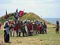 Historical re-enactors of Byzantine soldiers, with flags inspired by the Madrid Skylitzes