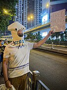 A protester with a squid mask, Halloween 2019