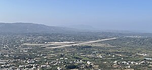 This is a aerial view of Rhodes Air Base used by the Hellenic Air Force. In 1977 civilian traffic stopped and moved to the newer Rhodes Diagoras Airport. Image taken from Filerimos Cross.