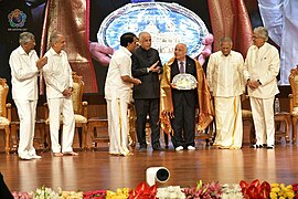 Ryuko Hira being felicitated by Sri Sathya Sai Central Trust during the inauguration of 'Sai Hira Global Convention Centre'