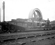 Flatcar loaded with a flywheel 1900.[112]