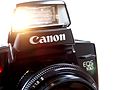 Canon EOS 100 camera with bright light to contract pupils