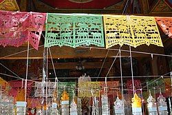Tung flags inside a temple in Mae Wang
