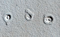 Rootless cones on Mars – due to lava flows interacting with water (MRO; January 4, 2013) (21°57′54″N 197°48′25″E﻿ / ﻿21.965°N 197.807°E﻿ / 21.965; 197.807).