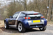 A Smart Roadster Coupe convertible.
