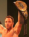 Eli Drake with a modified version of the fourth title belt design; which added a "Impact Wrestling" plate to the title belt to cover the Global Force Wrestling logo after the company's brief use of that name