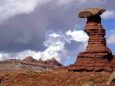 Hoodoo within the Chinle Formation, west of Moab, Utah, along the Hurrah Pass backroad. Ridge in background is part of the Wingate Sandstone.