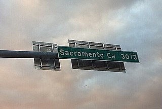 Sign at the eastern terminus of US 50 in Ocean City listing the distance to the western terminus in Sacramento, California