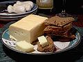 Image 3 Limburger cheese Photo credit: Jon Sullivan/Pharaoh Hound A plate of Limburger cheese and pumpernickel bread. Limburger originated from Limburg, Belgium, and is known for its strong odor, which is due in part to being fermented with the same bacteria partially responsible for human body odor. More selected pictures