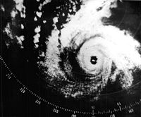 A radar image depicting a mature and well-formed storm, with a pronounced eye at the center and curved bands.