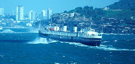 Crossing the Sydney Heads in Urban Transit Authority colours, showing masts added after her final refit. Middle Head in the background, 1984