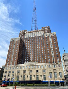 A 1928-vintage hotel building with a large steel tower atop it