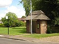 The thatched roof bus shelter