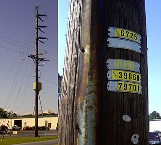 The tags on a Delmarva Power subtransmission pole located in Crisfield, Maryland, United States. The faded tag reads "733"