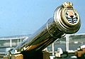 Tampion of a brass cannon with the crest of the British Leander-class frigate, HMS Bacchante in 1976