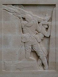 The second of Charles Sergeant Jagger's reliefs at Cambrai. A wounded man is lifted from the trenches.
