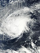 A cyclone with banding clouds wrapping cyclonically over its center