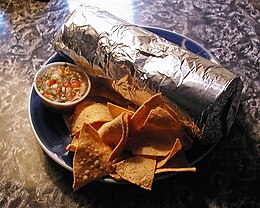 Plate with foil-wrapped burrito, chips, and salsa