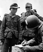 Yang Kyoungjong, a Korean soldier of the Wehrmacht who was captured by US personnel and photographed at Normandy in 1944.