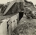 British officer looking at gravestones from the desecrated Jewish cemetery used to construct German defences, 1944