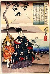 A woodcarving showing a man in a blue kimono looking up