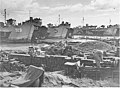 USS LST-919, LST-922, and LST-990 beached at Mindoro Island, Philippines, 15 December 1944, unloading supplies and equipment