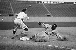Ty Cobb sliding into third base