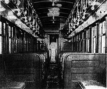 Interior of a railway car with two rows of seats