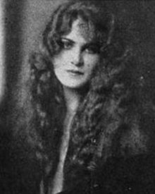 A young white woman with long wavy hair
