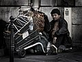 A homeless man (a "sans domicile fixe") in Paris.