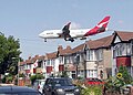 Image 16Qantas Boeing 747-400 about to land at Heathrow Airport, seen beyond the roofs of Myrtle Avenue, Hounslow.