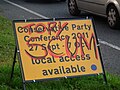 "Tory scum" graffitied over a road sign about the Conservative Party Conference