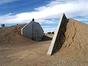 Ammo Bunker (S-1008), SW of Vosler Dr. (formerly Alaska Dr.), at Arizona State University at the Polytechnic campus (formerly Williams AFB). Built in 1942 by the Del E. Webb Construction Company. Listed in the National Register of Historic Places ref: 95000759.