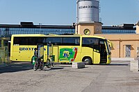 A long yellow bus