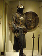 Tibetan mirror armour; four mirrors (me long bzhi) with the front and one side plate visible and worn over a mail hauberk.