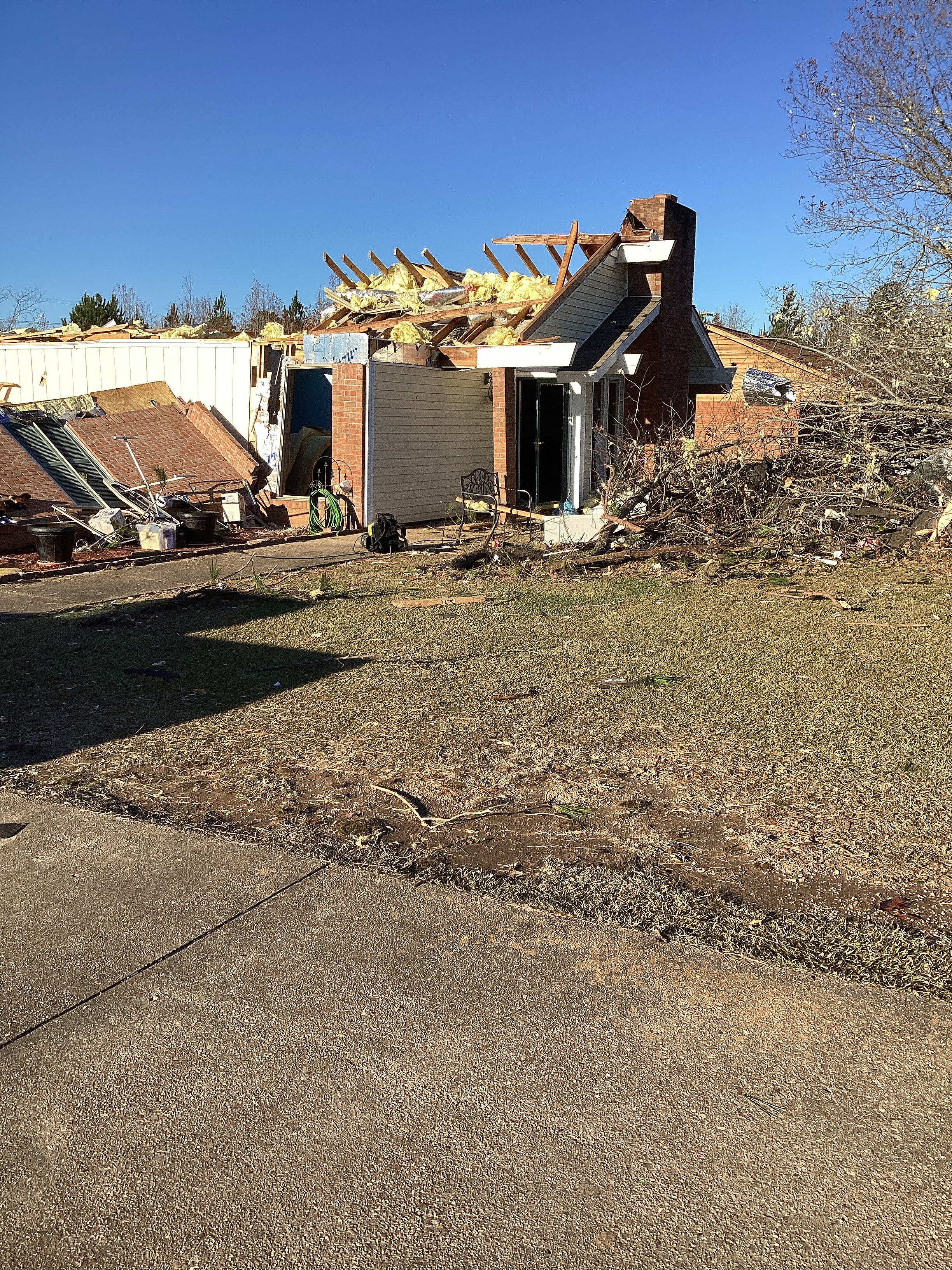 A home that suffered heavy high-end EF2 damage near Woodlawn, Mississippi.