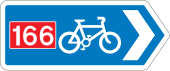 Rectangular, blue traffic sign with a white bicycle symbol and a red square with the number 166 in it.