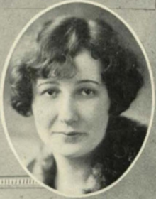 A white woman with wavy bobbed hair, in an oval frame