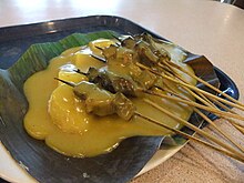 Sate Padang with yellow sauce