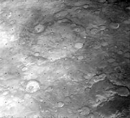 Oblique view of Cassini and vicinity from Viking Orbiter 1, also showing Pasteur crater (lower left), Indus Vallis (right), Scamander Vallis (bottom), and Arago crater (bottom right corner)
