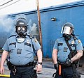 Officers of the Saint Paul Police Department in FM12 gas masks on 2020 George Floyd protests in the city