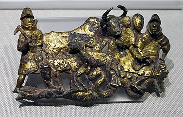 The ox is featured heavily in Dian artwork. This bronze belt buckle for example shows Dian armoured warriors around an ox and its calves.