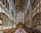 The choir of Gloucester Cathedral conveys an impression of a "cage" of stone and glass. Window tracery and wall decoration form integrated grids.