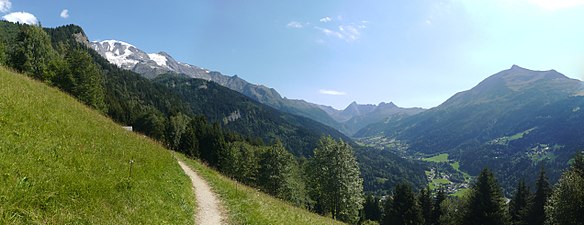 Summer view of the valley of Les Contamines ; left: the snow-capped Dômes, facing Mont-Joly.